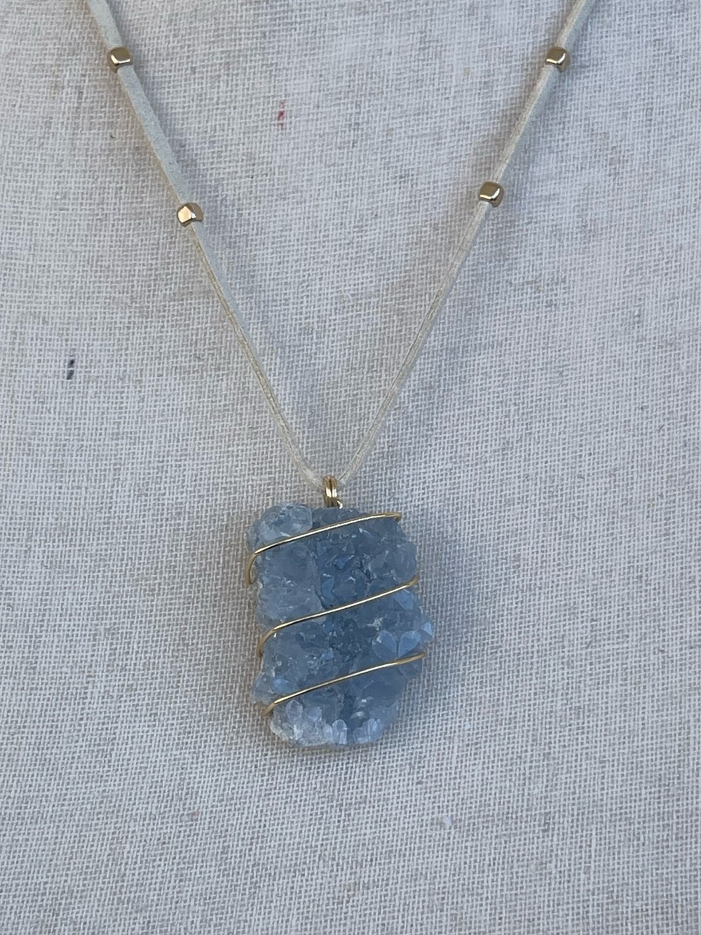 Blue Celestite Druzy Pendant Necklace with Gold Wire Wrap on White Suede Cord